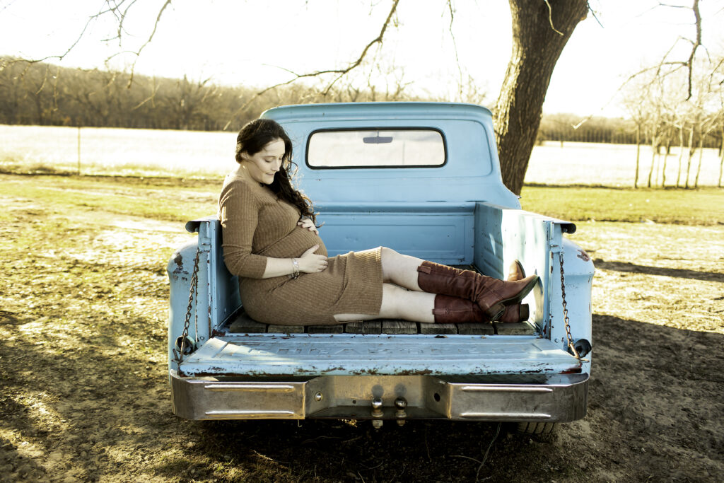 Maternity photoshoot with glowing mom-to-be by the classic old blue truck